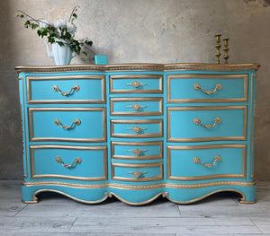 Blue and gold dresser suitable for any room in your home.